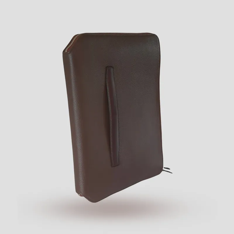 A custom folio handcrafted in chestnut premium cowhide leather with a taupe leather lining.
