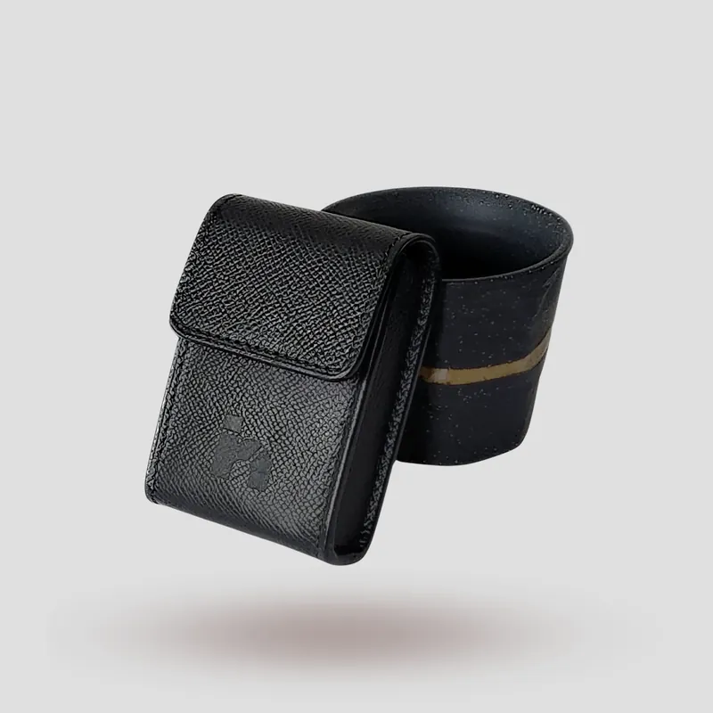 A custom hearing aid case handcrafted in black premium Epsom cowhide leather.