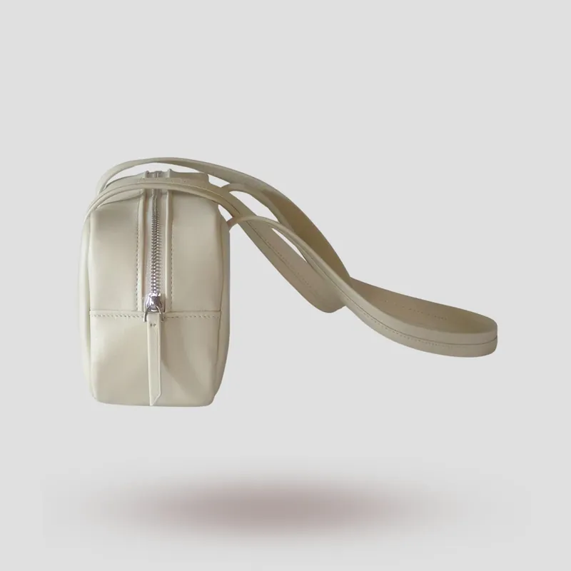 A custom shoulder bag handcrafted in off-white premium cowhide leather.