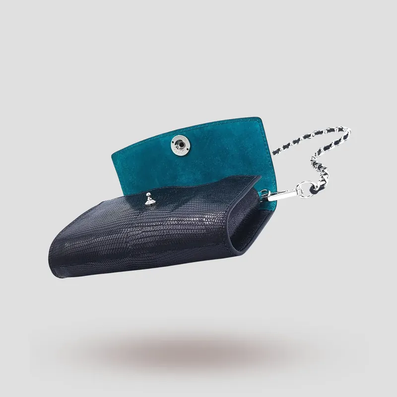 A custom clutch handcrafted in black premium lizard leather.