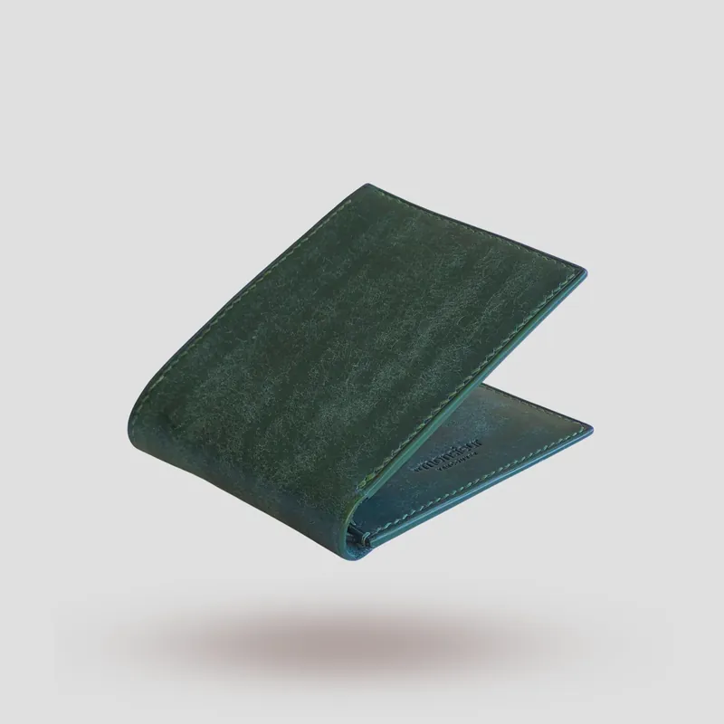 A custom wallet handcrafted in forest green premium Pueblo vegetable-tanned cowhide leather.