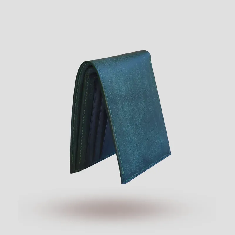 A custom wallet handcrafted in forest green premium Pueblo vegetable-tanned cowhide leather.