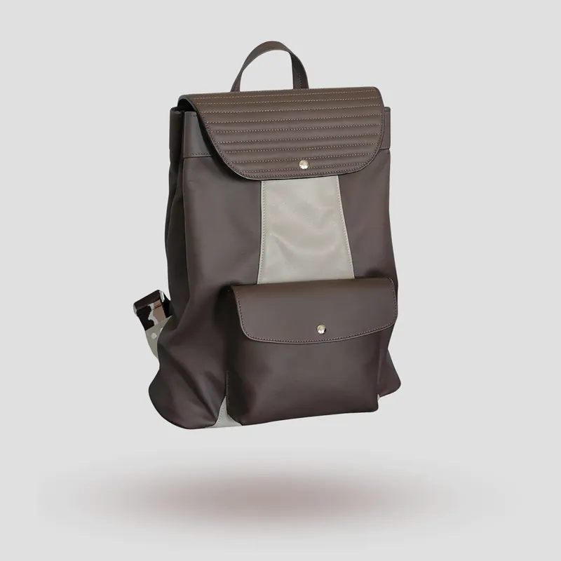 A custom backpack handcrafted in mocha and off-white premium cowhide leather.
