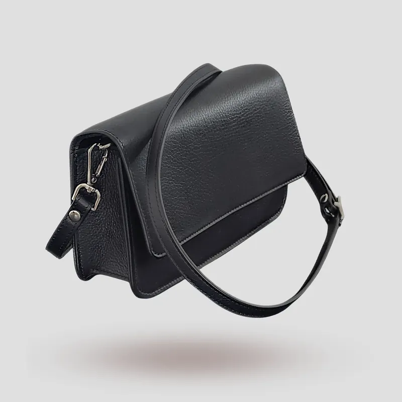 A custom pochette bag handcrafted in black premium cowhide leather.