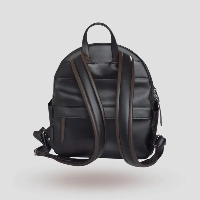 A custom backpack handcrafted in black first-grade Italian calfskin, finished with a French-seam accent and a touch of brown leather.