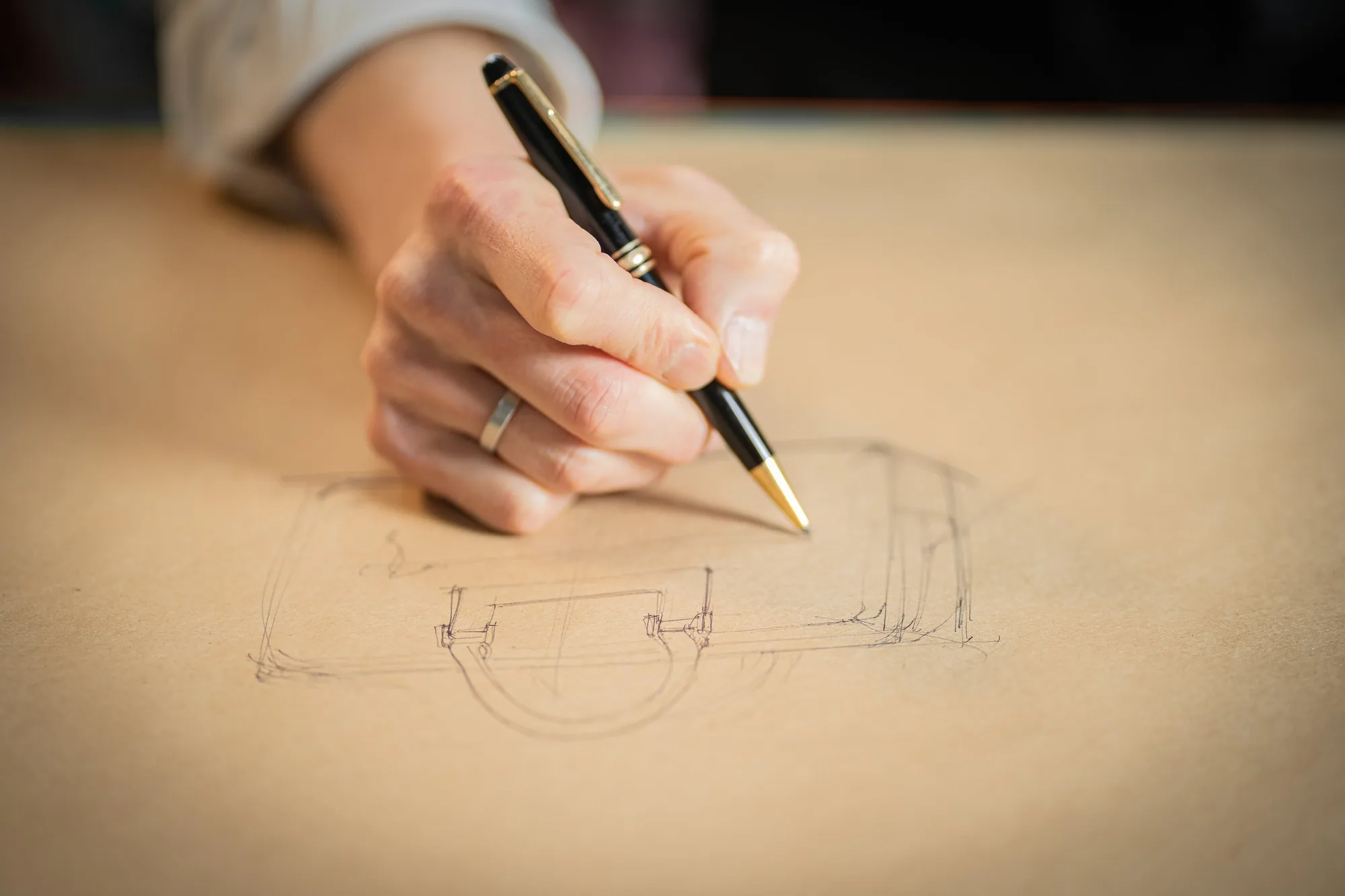 Joe sketching a design in his atelier, photographed by Dani Cruz Photography