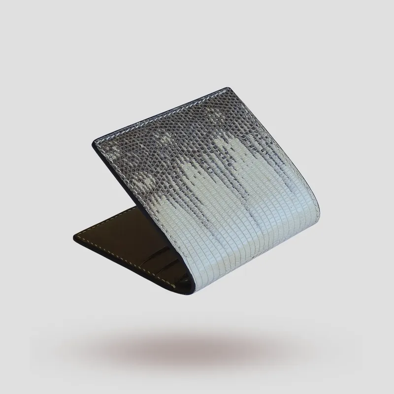 A custom wallet handcrafted in lizard skin with a beige-grey premium Pueblo vegetable-tanned cowhide leather interior.