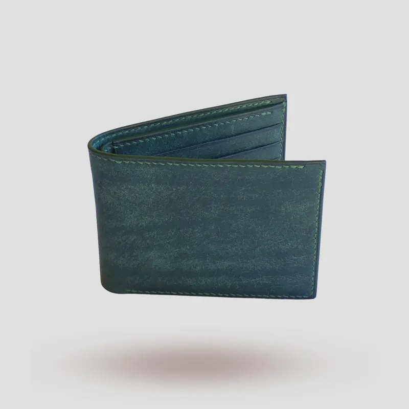 A custom wallet handcrafted in forest green premium Pueblo vegetable-tanned cowhide leather.
