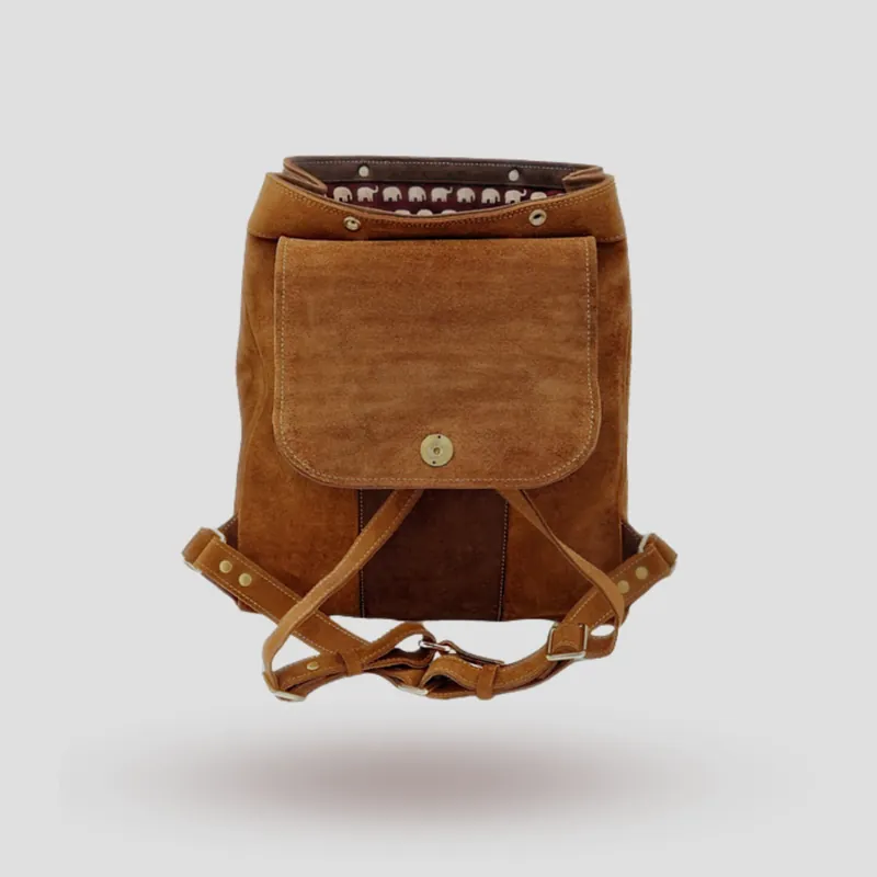 A custom backpack handcrafted in brown premium suede with accents in cowhide leather.