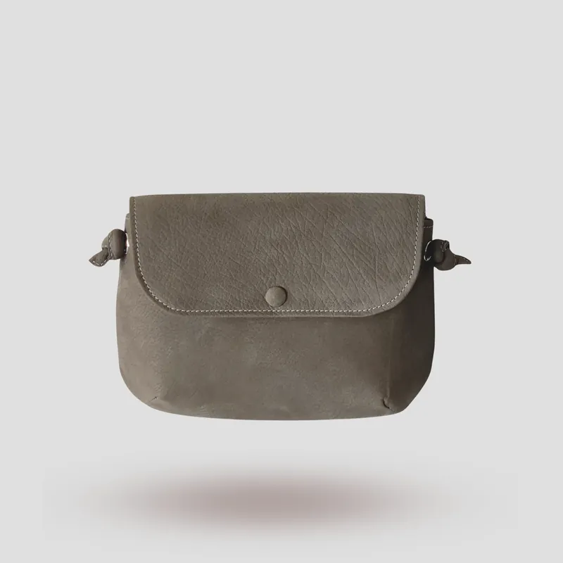 A signature crossbody bag handcrafted in grey premium nubuck.