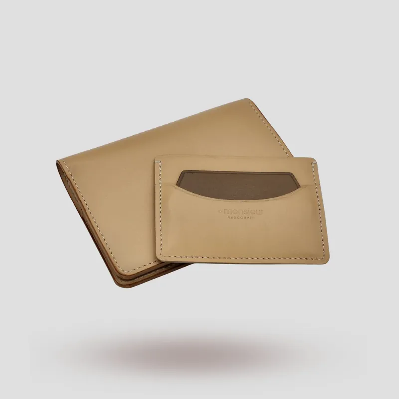 A custom passport cover and its companion cardholder handcrafted in beige premium cowhide leather.