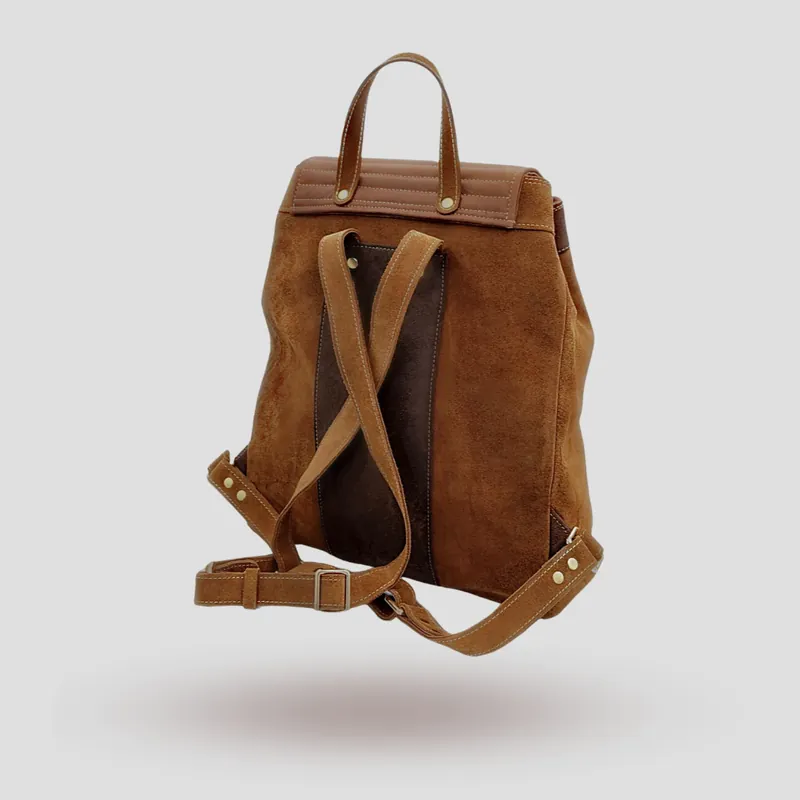 A custom backpack handcrafted in brown premium suede with accents in cowhide leather.