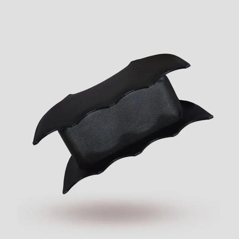 A custom bat-shaped handbag, handcrafted in black Epsom full-grain leather, with a grommet at the base of the handle for attaching charms.