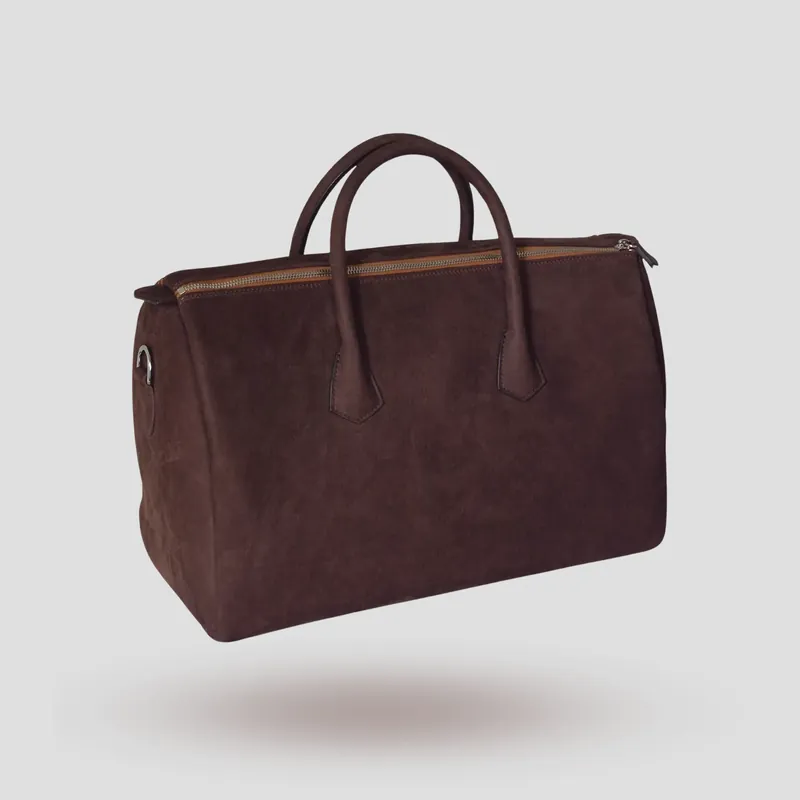 A custom Boston bag handcrafted in chocolate brown premium Italian nubuck.