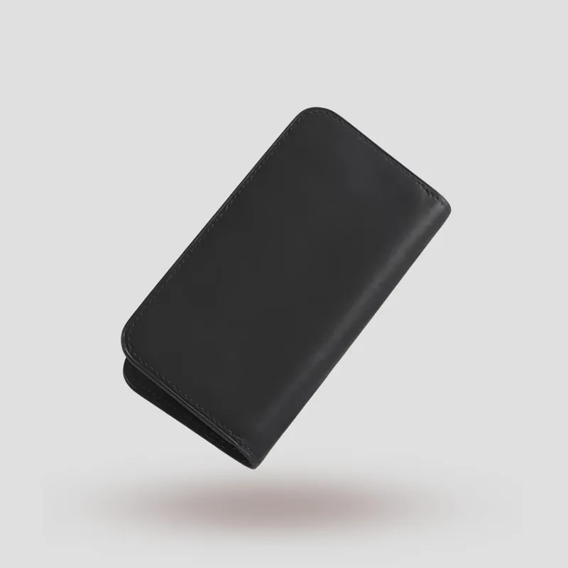 A custom iPhone Folio handcrafted in black premium Italian vegetable-tanned leather.