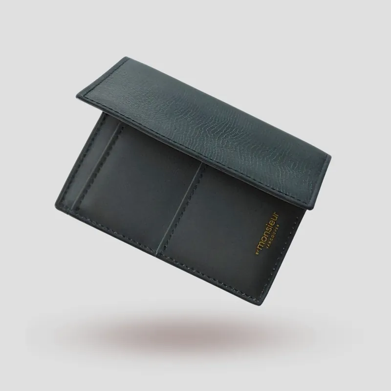 A custom passport cover handcrafted in dark green lizard-embossed premium cowhide with a mocha goatskin lining.
