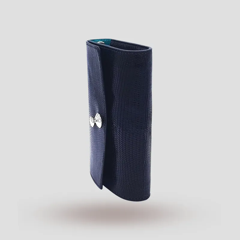 A custom clutch handcrafted in black premium lizard leather.