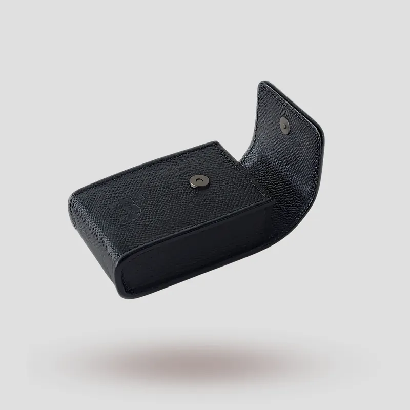 A custom hearing aid case handcrafted in black premium Epsom cowhide leather.