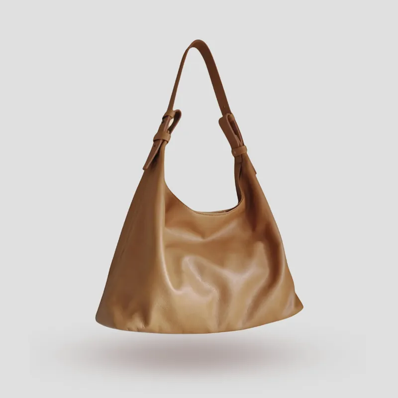 A custom hobo bag handcrafted in beige supple premium cowhide leather.
