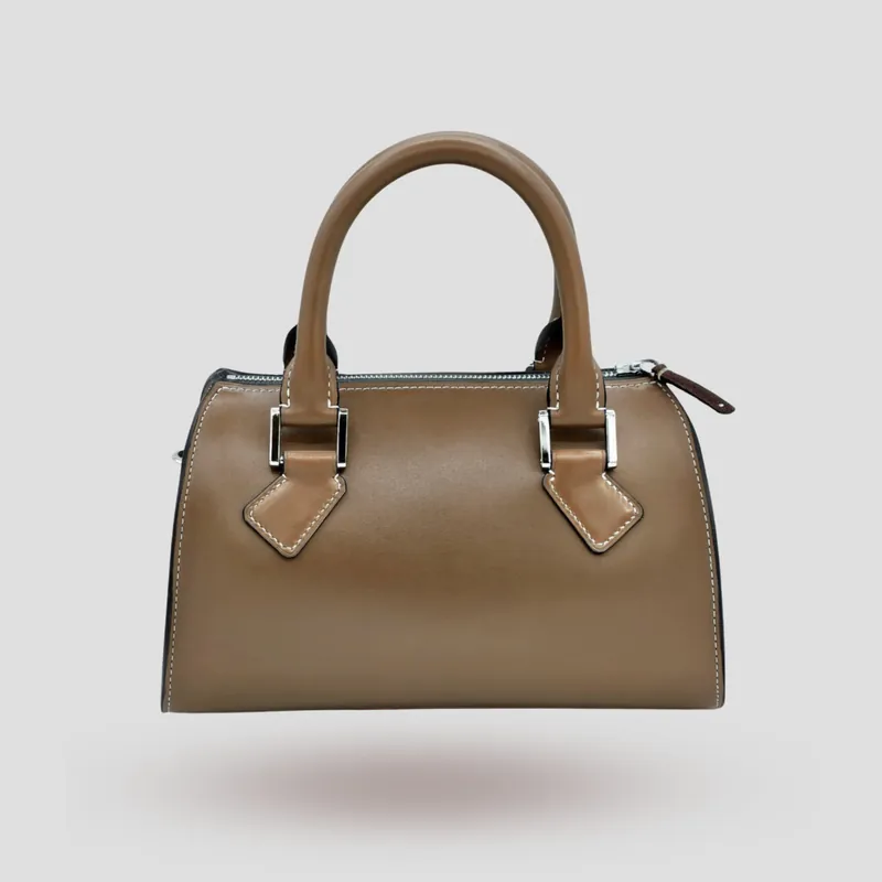 A custom Boston bag handcrafted in mocha premium cowhide leather.