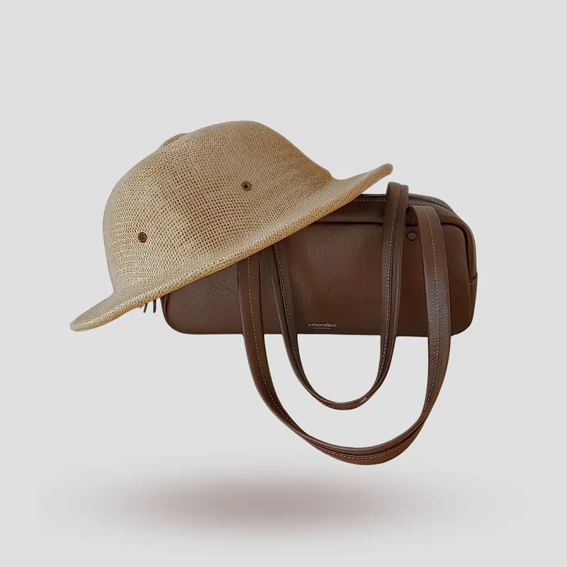 A custom shoulder bag handcrafted in rich brown premium cowhide leather.
