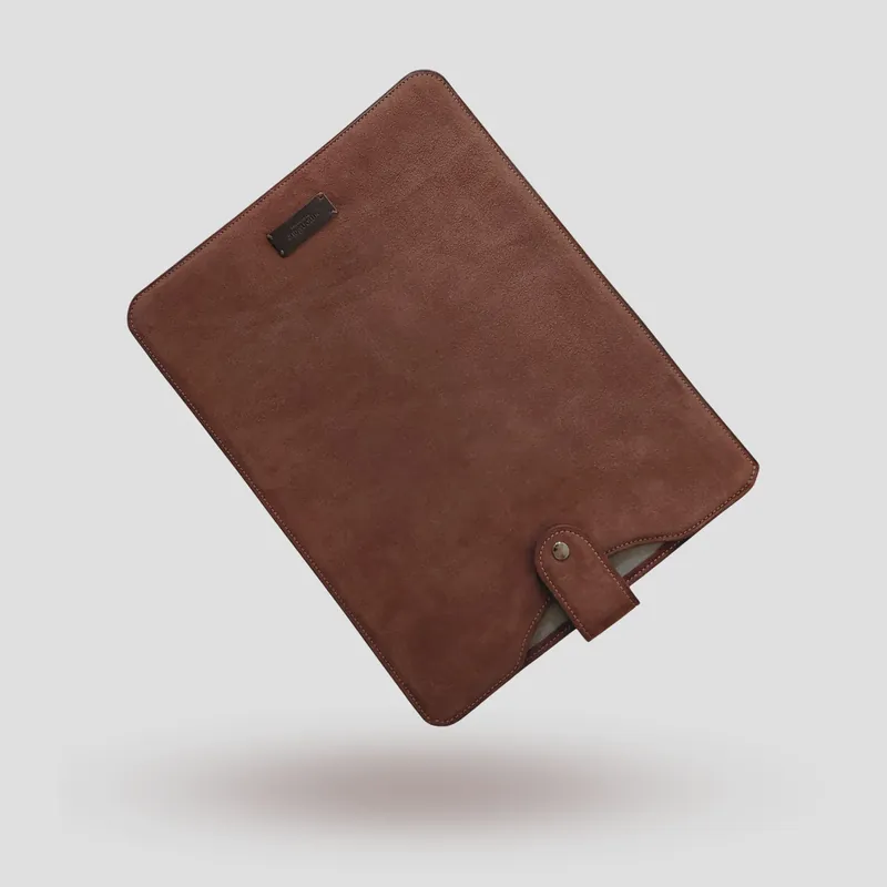 A custom laptop sleeve handcrafted in brown premium suede.
