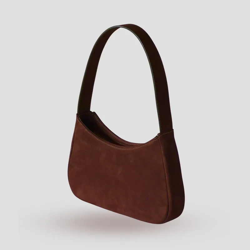 A custom shoulder bag handcrafted in dark chocolate premium Italian nubuck with a dark brown cowhide leather lining.