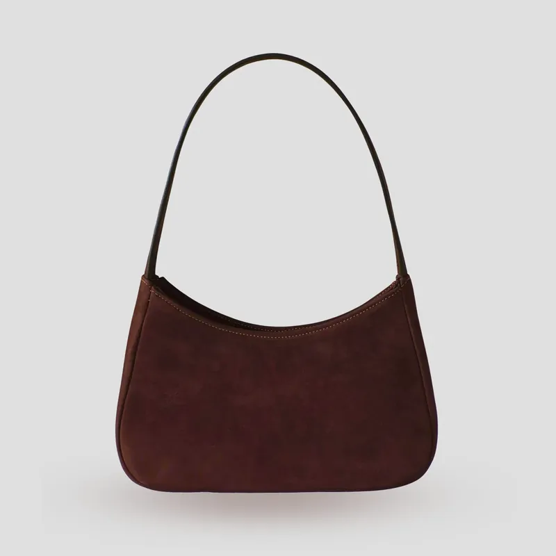 A custom shoulder bag handcrafted in dark chocolate premium Italian nubuck with a dark brown cowhide leather lining.