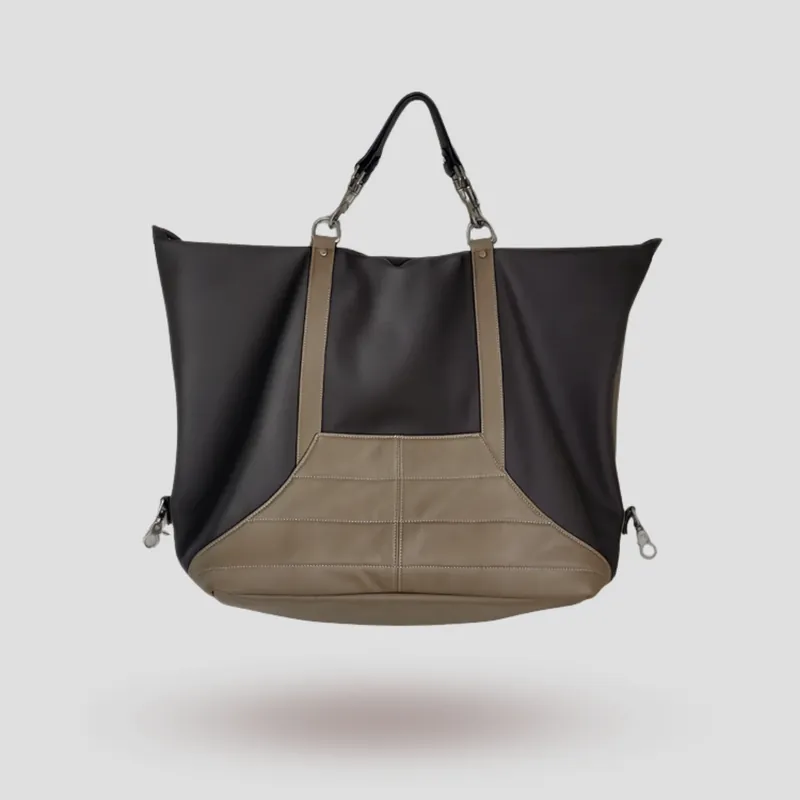 A custom travel bag handcrafted in chocolate brown and mocha premium supple cowhide leather.