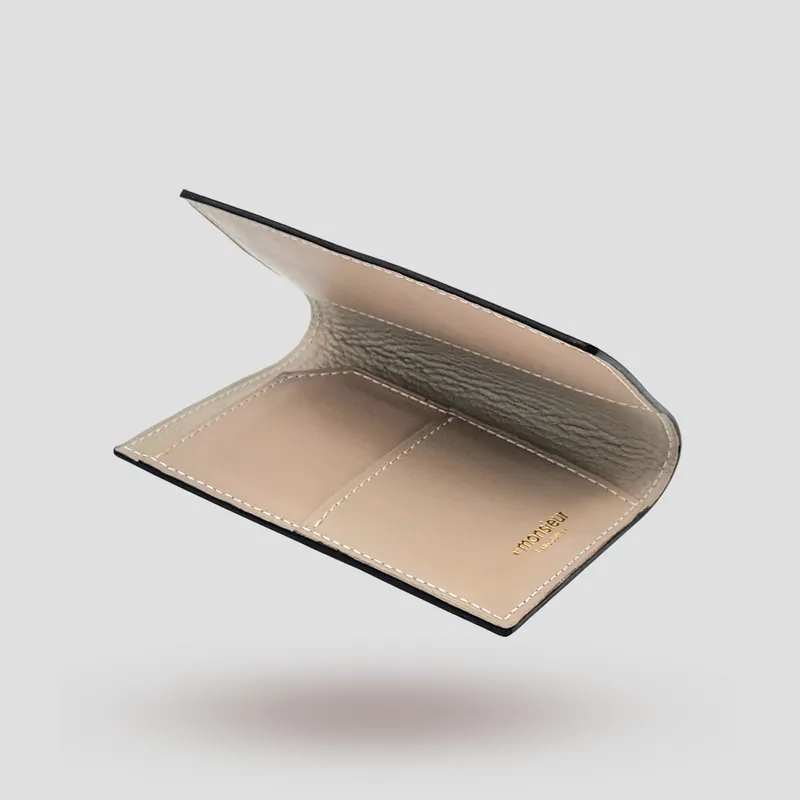 A custom passport cover handcrafted in red premium cowhide leather with an off-white goatskin lining.