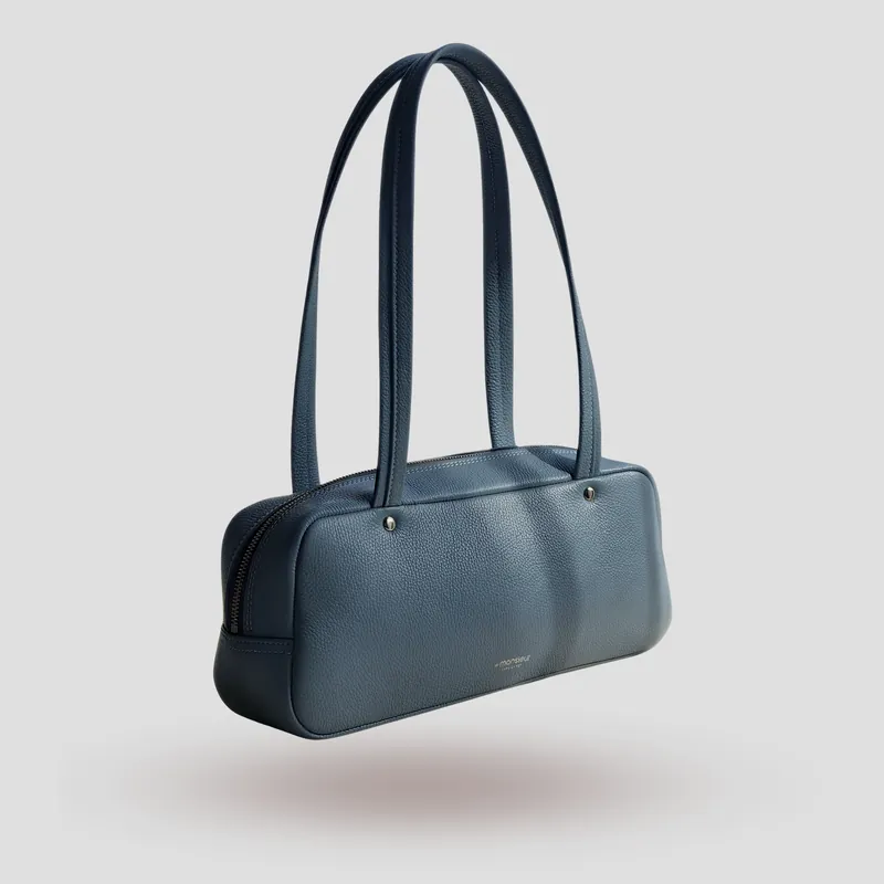 A custom shoulder bag handcrafted in powder blue premium cowhide leather.