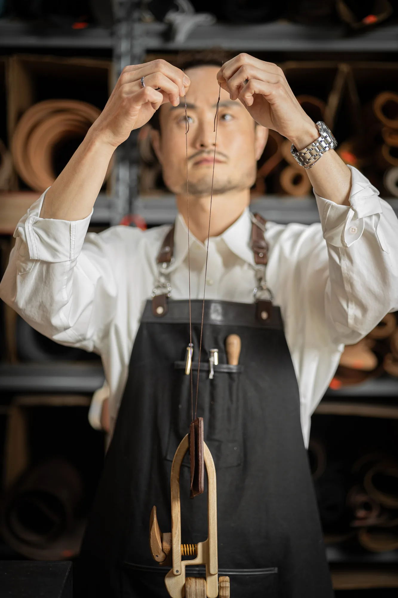 Joe threading a tool in his atelier, photographed by Dani Cruz Photography