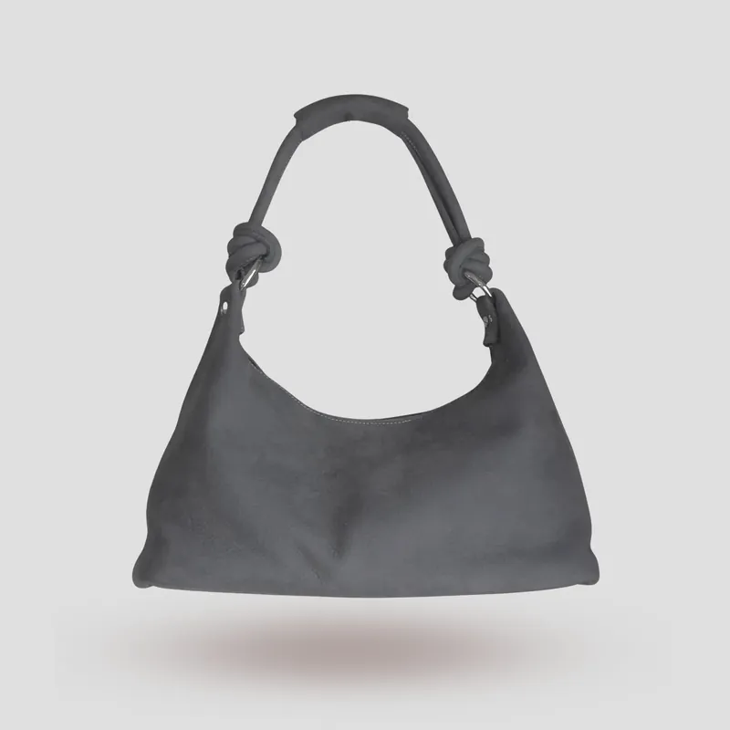 A custom hobo bag handcrafted in toned-down light blue premium nubuck with a light grey lining.