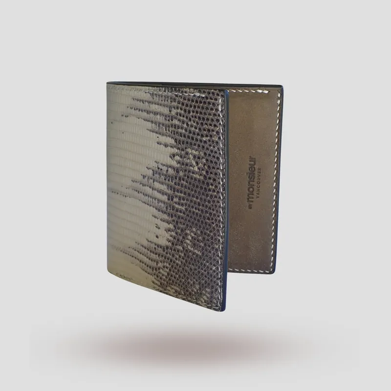 A custom wallet handcrafted in lizard skin with a beige-grey premium Pueblo vegetable-tanned cowhide leather interior.