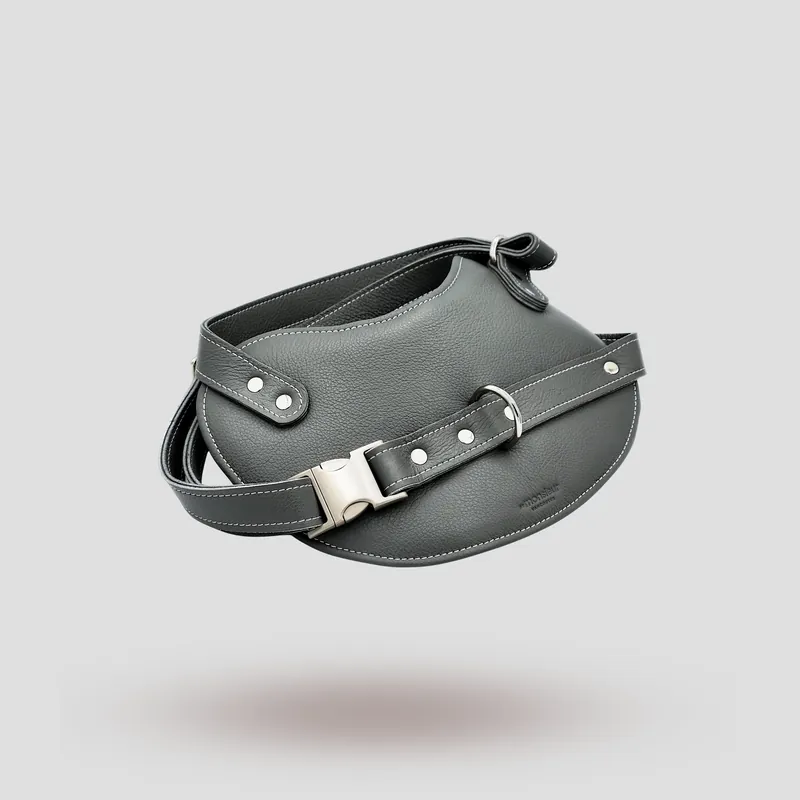 A custom dog harness handcrafted in grey premium cowhide leather.
