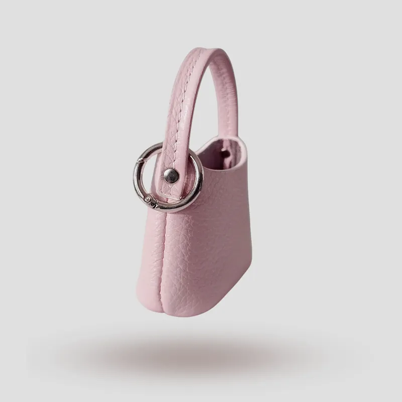 A custom mini bag keyring handcrafted in pink premium cowhide leather.
