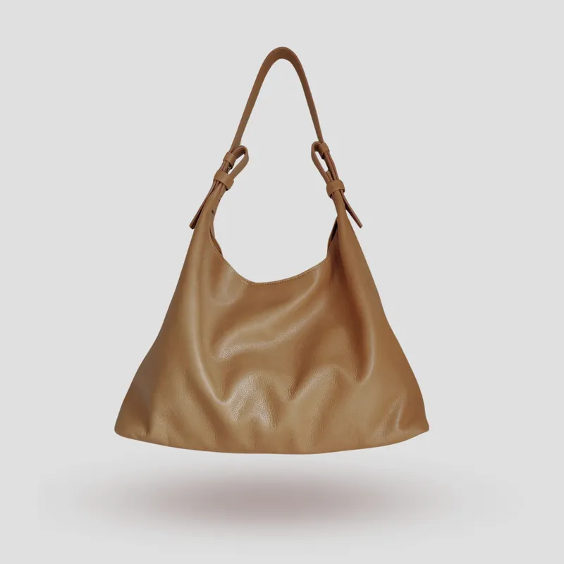A custom hobo bag handcrafted in beige supple premium cowhide leather.