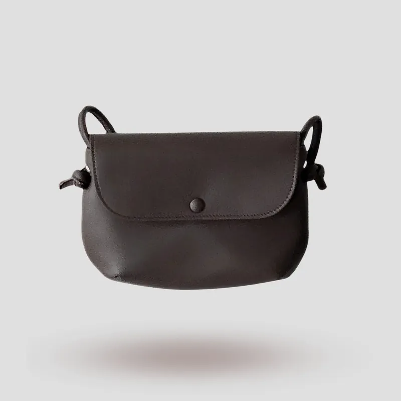 A signature crossbody bag handcrafted in brown premium cowhide leather.