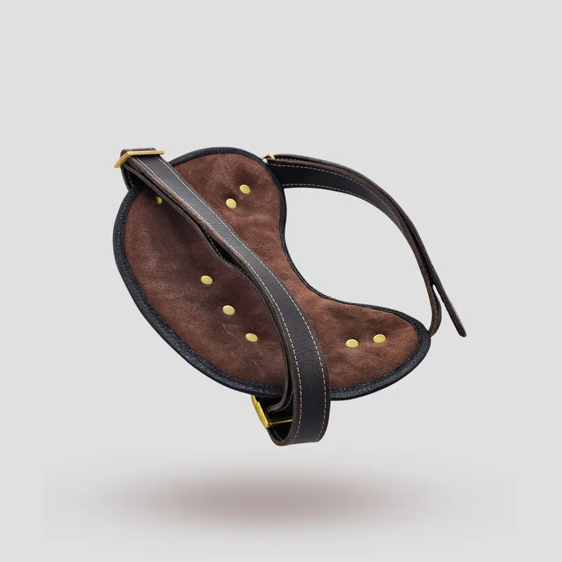 A custom dog harness handcrafted in brown premium cowhide leather with a suede lining.
