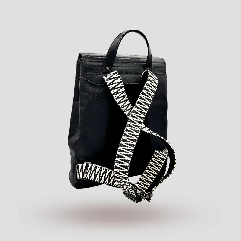 A custom backpack handcrafted in black premium cowhide leather and suede.