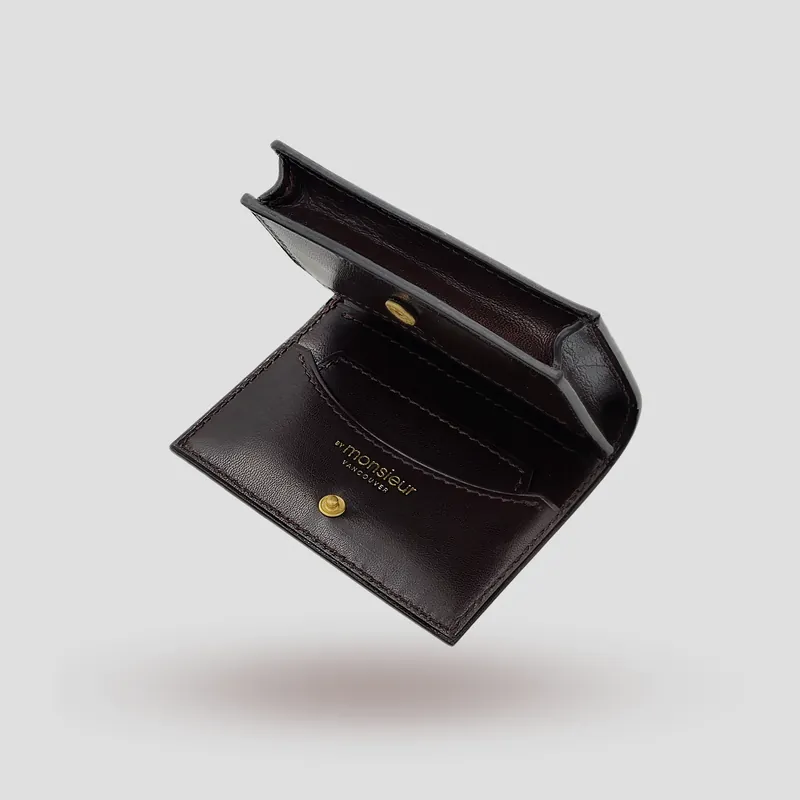 A custom wallet handcrafted in dark brown premium cowhide leather.