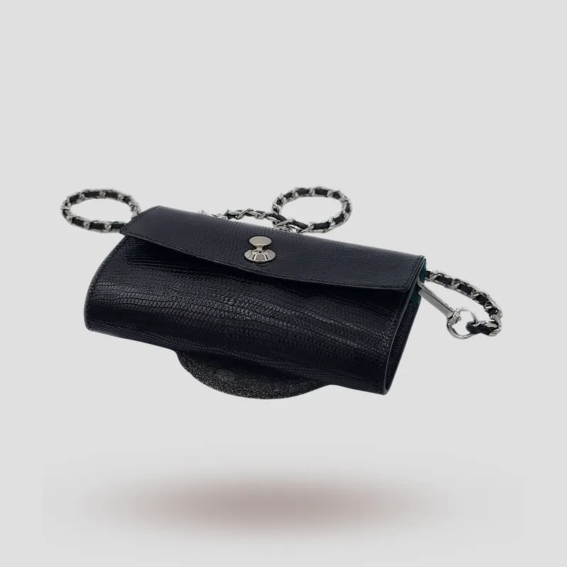 A custom clutch handcrafted in black premium lizard leather.