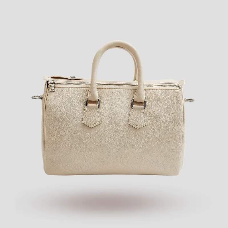 A custom Boston bag handcrafted in off-white premium cowhide leather.