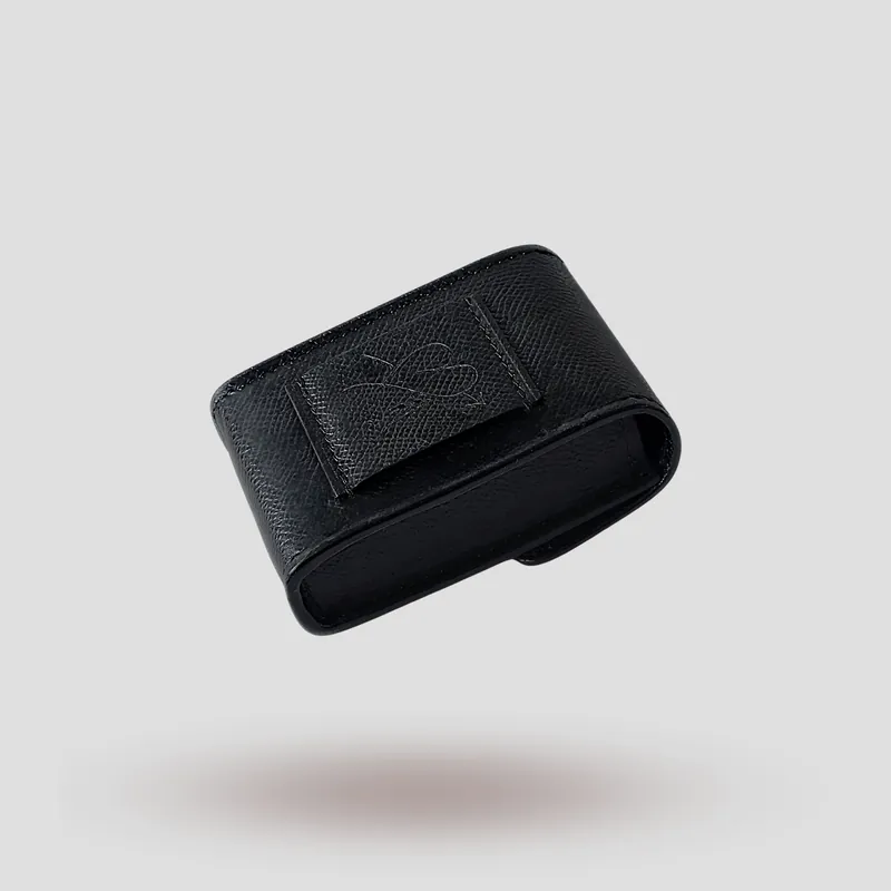 A custom hearing aid case handcrafted in black premium Epsom cowhide leather.