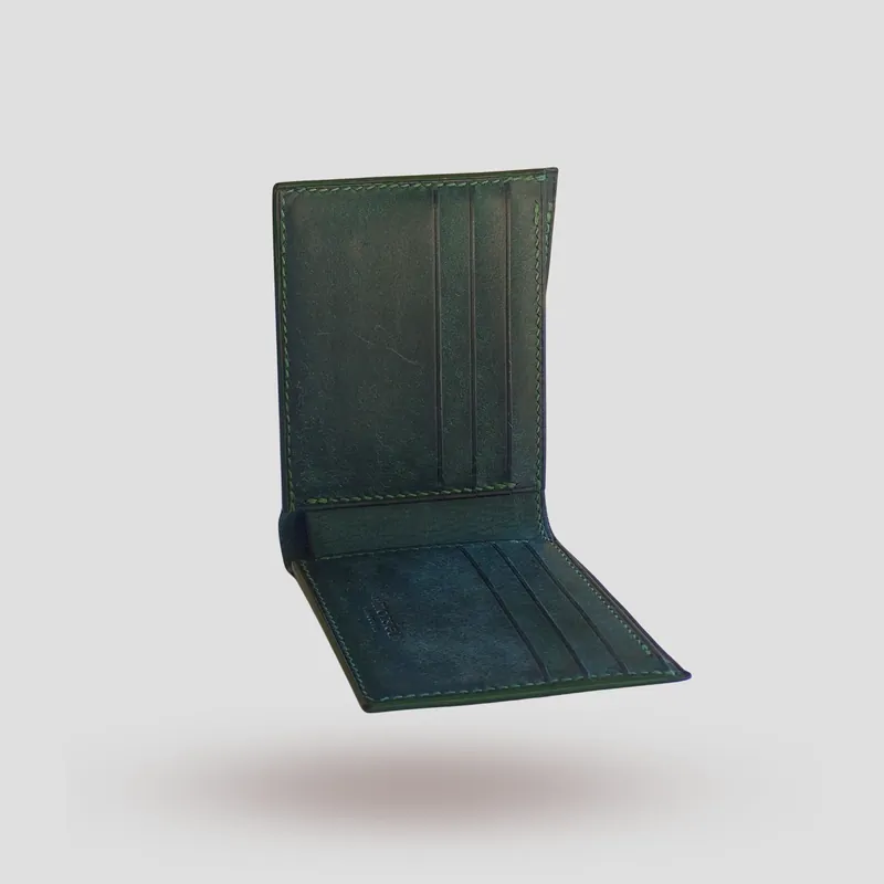 A custom wallet handcrafted in forest green premium Pueblo vegetable-tanned cowhide leather.