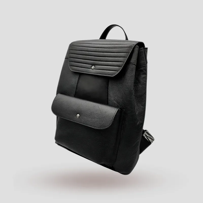 A custom backpack handcrafted in black premium cowhide leather and suede.