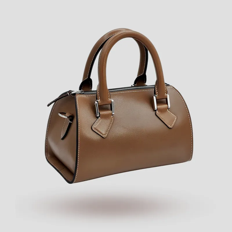 A custom Boston bag handcrafted in mocha premium cowhide leather.