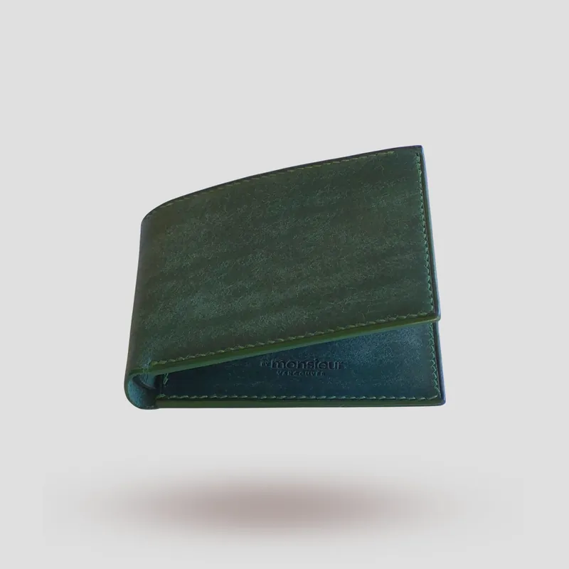 A custom wallet handcrafted in forest green premium Pueblo vegetable-tanned cowhide leather.